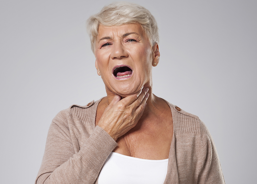 Senior Woman Has Big Problems With Sore Throat